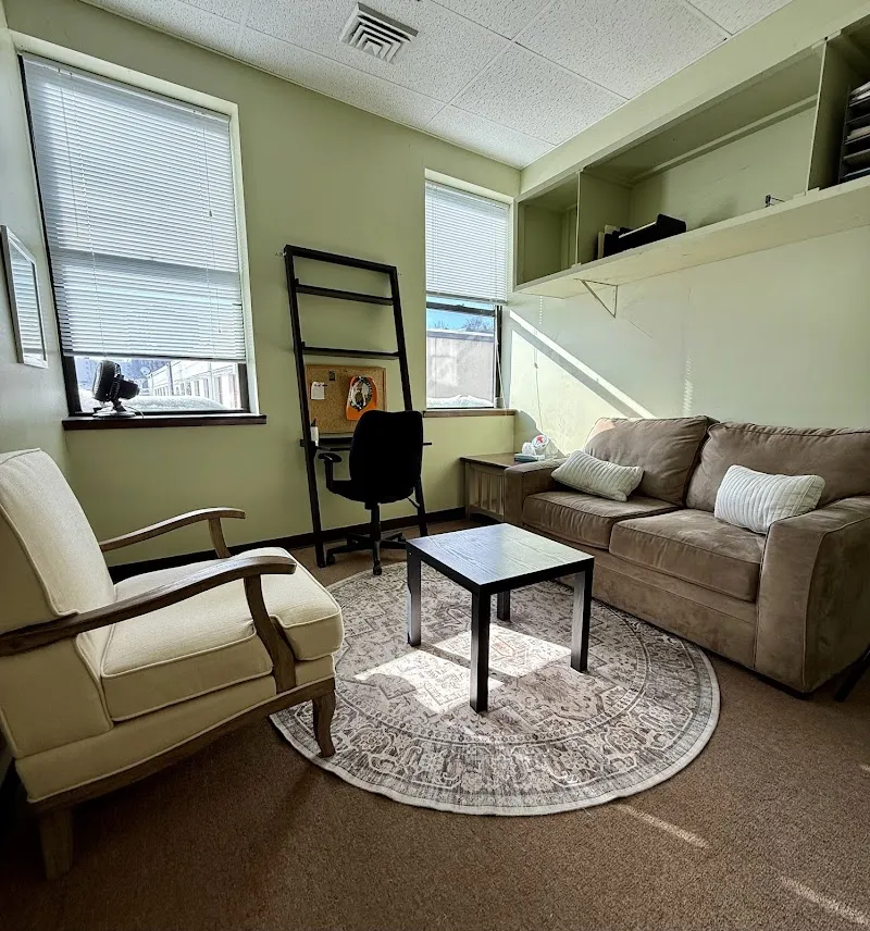Cozy sitting area with a rug at VK New England Management LLC detox center in Boston.