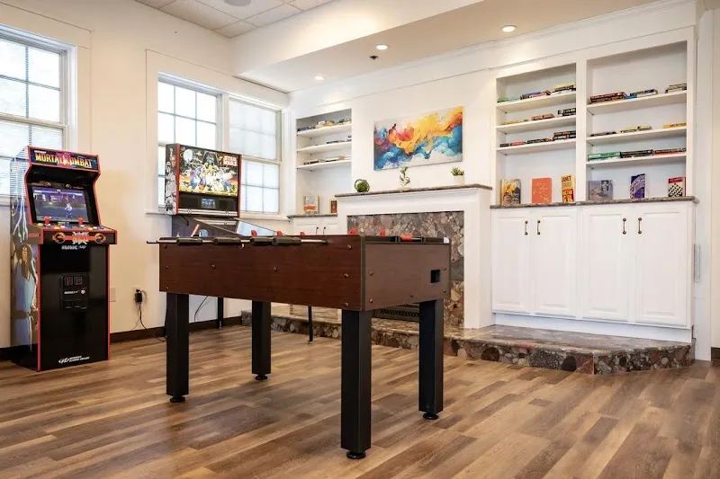 Game room with foosball table at Shore Point Recovery, a luxury detox center in Boston.