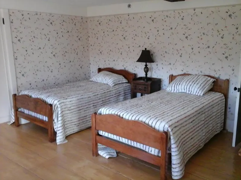 Cozy bedroom with two beds at Baldpate Treatment Center, a detox center in Boston.