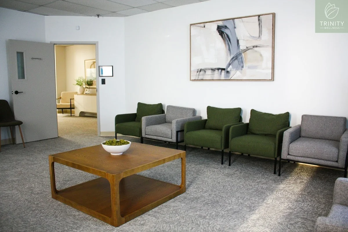 Inviting waiting area with green chairs at Trinity Wellness, an intensive outpatient program in Boston.