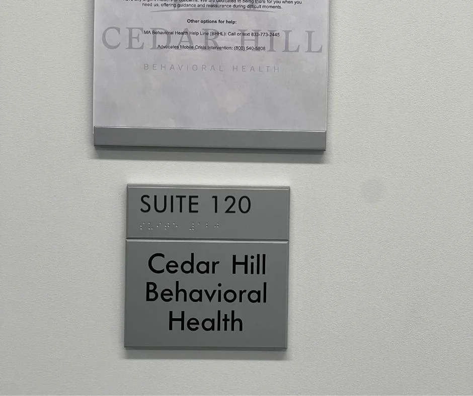 Sign for Cedar Hill Behavioral Health, a partial hospitalization program in Boston, located in Suite 120.