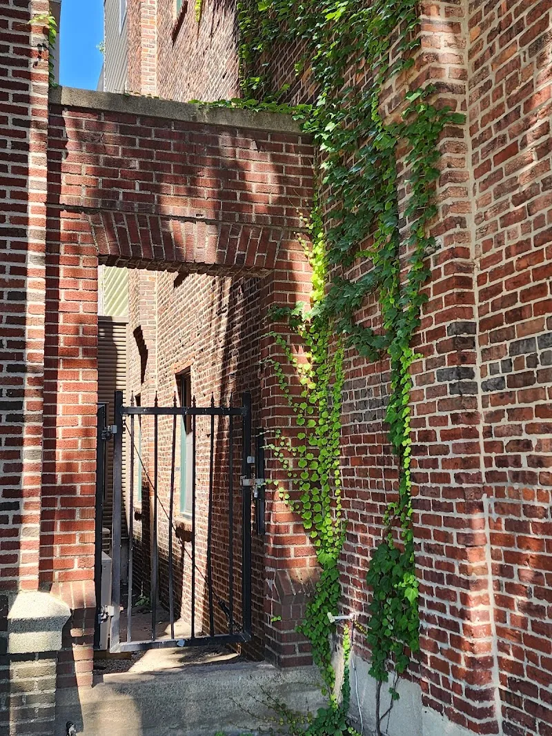 Brick archway with greenery at Rosie's Place, a sober living home in Boston.