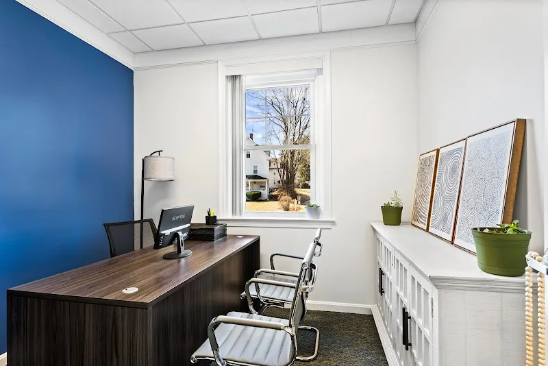 Bright office space with desk at Tower Hill Recovery Home, a sober living home in Boston.