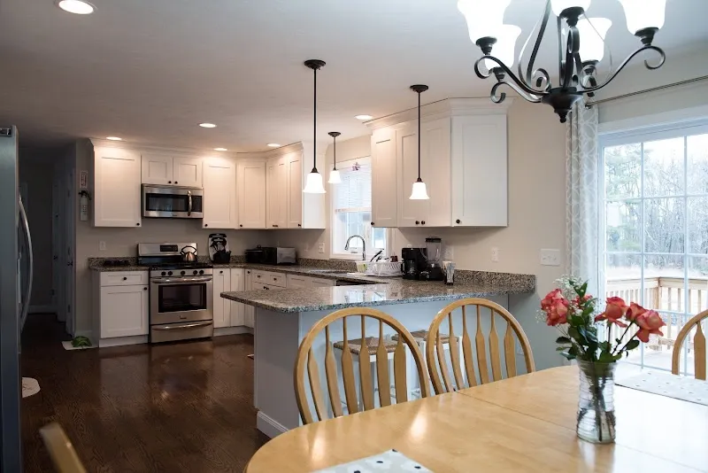 Modern kitchen with granite countertops at Megan's House, a sober living home in Boston.