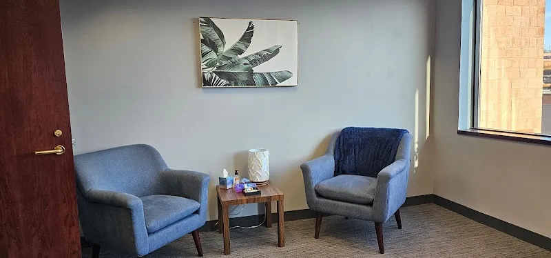 Cozy seating area with armchairs at Recovery Team/Newton, a treatment center in Boston.