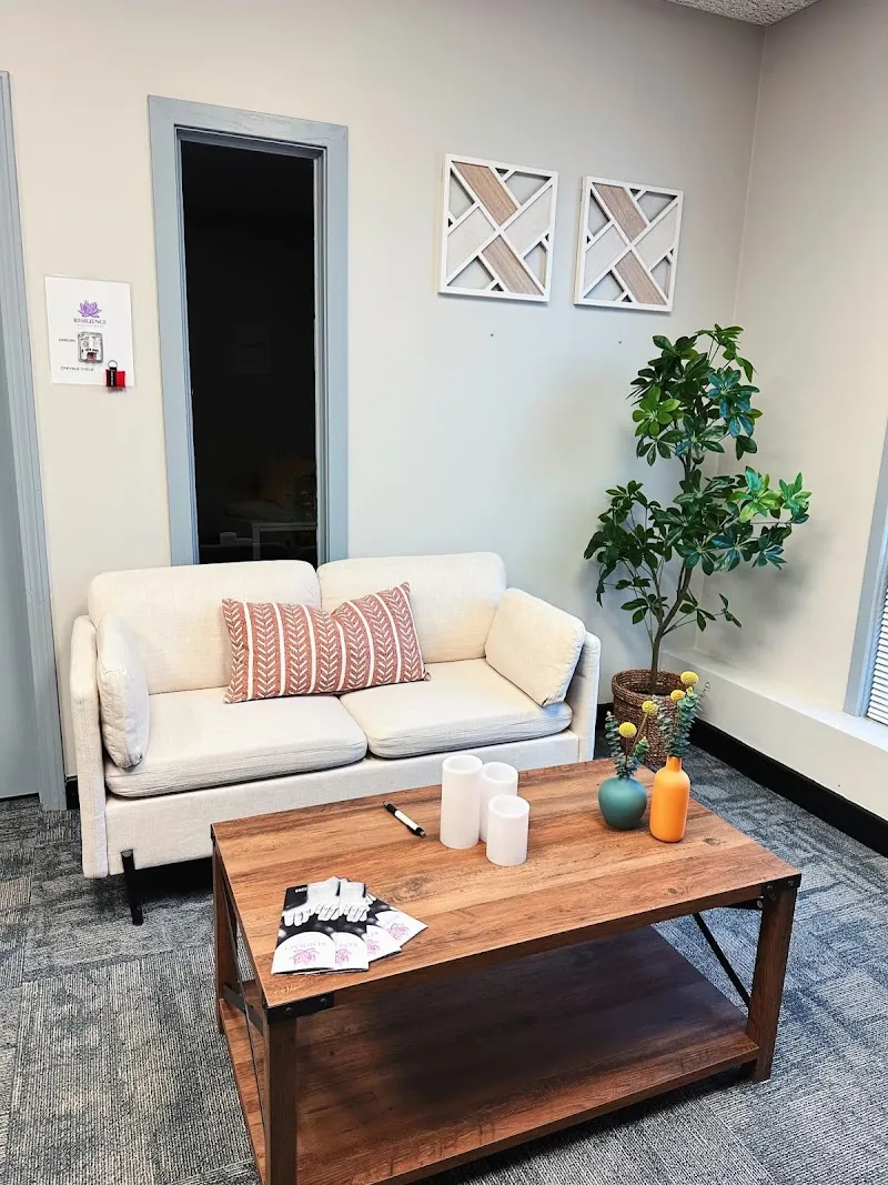 Cozy seating area with a coffee table at Resilience Behavioral Health treatment center in Boston.